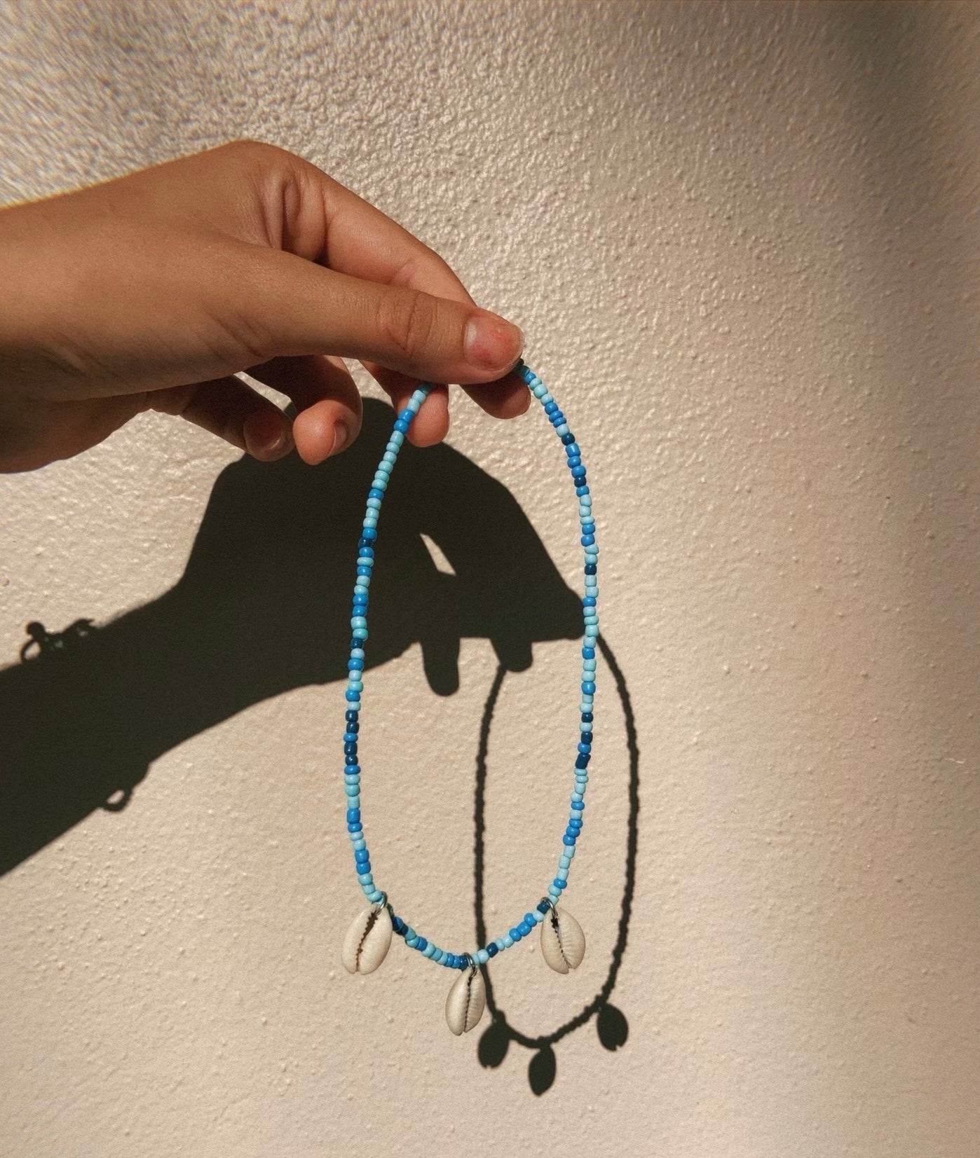 Blue glass bead cowrie chocker